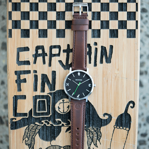 A close-up shot of a Captain Fin Co. surf fin, likely part of a collaboration, displayed on a landing page.
