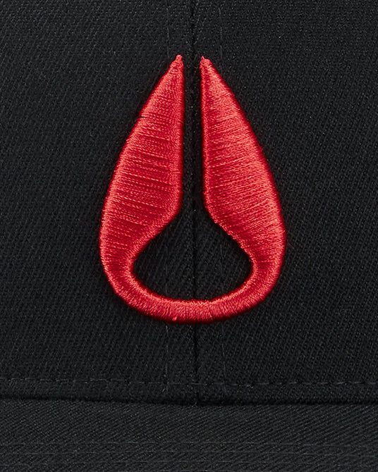 Close up of red Nixon logo on a black hat